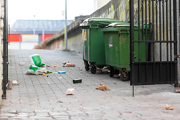 Image showing dumpsters on messy city street or courtyard