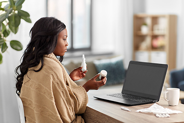 Image showing sick woman having video call on laptop at home