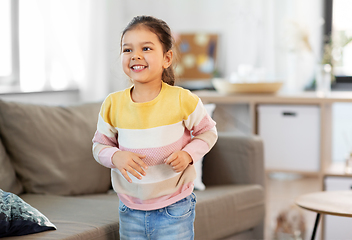 Image showing happy smiling little girl at home