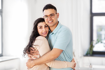Image showing happy couple hugging at home
