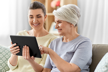 Image showing daughter and senior mother with tablet pc at home