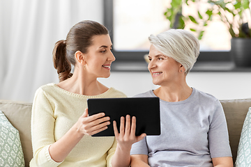 Image showing daughter and senior mother with tablet pc at home