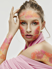 Image showing Portrait of beautiful young woman with modern floral design, inspiration artwork. Fashion, beauty concept.