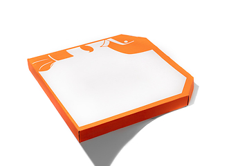 Image showing Close up of carton orange box for pizza isolated on white studio background with copyspace