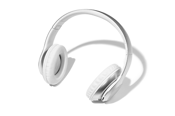 Image showing Wireless white headphones isolated on a white studio background with copyspace. Modern bluetooth technologies