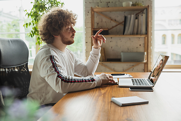 Image showing Manager or student working from home while being insulated or keep quarantine \'cause of coronavirus COVID-19. Online conference, meeting.