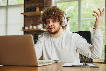 Image showing Manager or student working from home while being insulated or keep quarantine \'cause of coronavirus COVID-19. Online meeting.