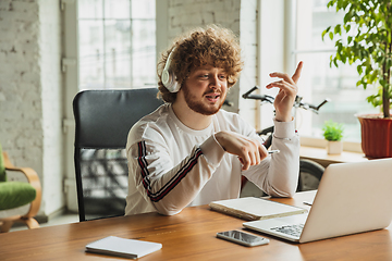 Image showing Manager or student working from home while being insulated or keep quarantine \'cause of coronavirus COVID-19. Online conference, meeting.