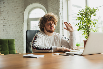 Image showing Manager or student working from home while being insulated or keep quarantine \'cause of coronavirus COVID-19. Online conference, meeting.