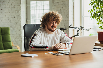 Image showing Manager or student working from home while being insulated or keep quarantine \'cause of coronavirus COVID-19. Online conference, meeting.