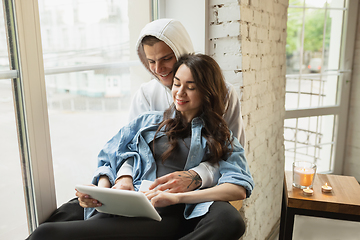 Image showing Quarantine lockdown, stay home concept - young beautiful caucasian couple enjoying new lifestyle during coronavirus worldwide health emergency