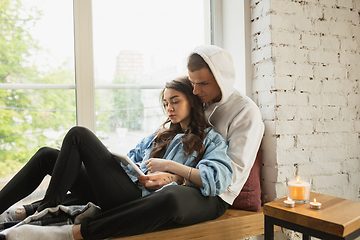 Image showing Quarantine lockdown, stay home concept - young beautiful caucasian couple enjoying new lifestyle during coronavirus worldwide health emergency