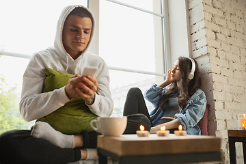 Image showing Quarantine lockdown, stay home concept - young beautiful caucasian couple enjoying new lifestyle during coronavirus worldwide health emergency