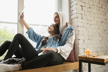 Image showing Quarantine lockdown, stay home concept - young beautiful caucasian couple enjoying new lifestyle during coronavirus worldwide health emergency