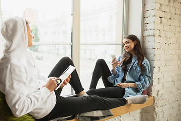 Image showing Quarantine lockdown, stay home concept - young beautiful caucasian couple enjoying new lifestyle during coronavirus worldwide health emergency