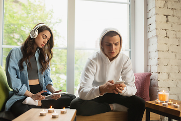 Image showing Quarantine lockdown, stay home concept - young beautiful caucasian couple enjoying new lifestyle during coronavirus worldwide health emergency