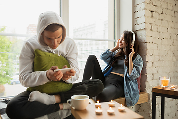 Image showing Quarantine lockdown, stay home concept - young beautiful caucasian couple enjoying new lifestyle during coronavirus worldwide health emergency