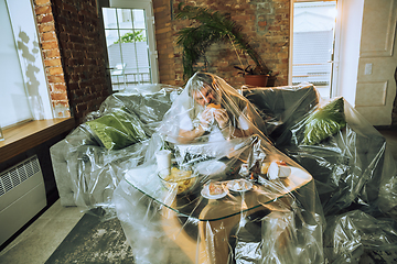 Image showing Senior man covered with plastic, eating fast food and drinking beer - environmental pollution by people concept