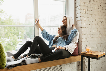 Image showing Quarantine lockdown, stay home concept - young beautiful caucasian couple enjoying new lifestyle during coronavirus worldwide health emergency