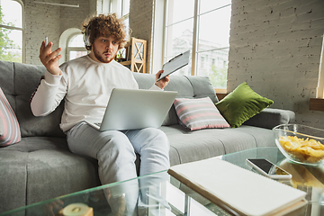 Image showing Manager or student working from home while being insulated or keep quarantine \'cause of coronavirus COVID-19. Conference online with colleague.