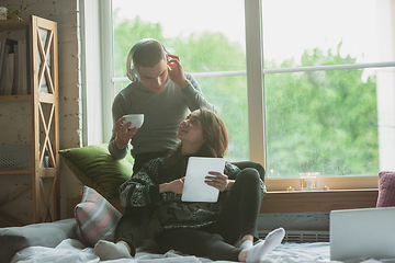 Image showing Quarantine lockdown, stay home concept - young beautiful caucasian couple enjoying new lifestyle during coronavirus worldwide health emergency