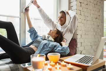 Image showing Quarantine lockdown, stay home concept - young beautiful caucasian couple enjoying new lifestyle during coronavirus worldwide health emergency