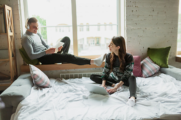 Image showing Quarantine lockdown, stay home concept - young beautiful caucasian couple enjoying new lifestyle during coronavirus worldwide health emergency