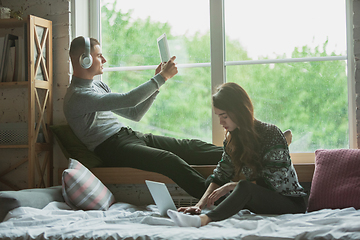 Image showing Quarantine lockdown, stay home concept - young beautiful caucasian couple enjoying new lifestyle during coronavirus worldwide health emergency