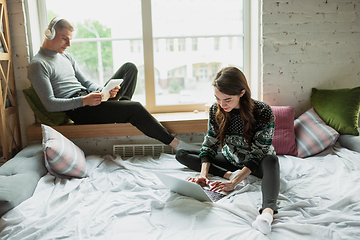 Image showing Quarantine lockdown, stay home concept - young beautiful caucasian couple enjoying new lifestyle during coronavirus worldwide health emergency