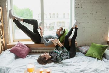 Image showing Quarantine lockdown, stay home concept - young beautiful caucasian couple enjoying new lifestyle during coronavirus worldwide health emergency