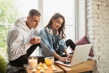 Image showing Quarantine lockdown, stay home concept - young beautiful caucasian couple enjoying new lifestyle during coronavirus worldwide health emergency