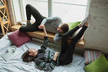 Image showing Quarantine lockdown, stay home concept - young beautiful caucasian couple enjoying new lifestyle during coronavirus worldwide health emergency