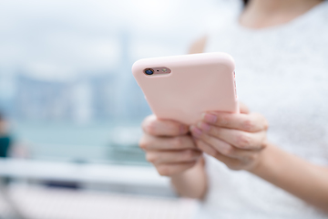 Image showing Woman using mobile phone online