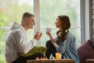 Image showing Quarantine lockdown, stay home concept - young beautiful caucasian couple enjoying new lifestyle during coronavirus worldwide health emergency