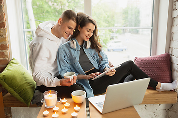 Image showing Quarantine lockdown, stay home concept - young beautiful caucasian couple enjoying new lifestyle during coronavirus worldwide health emergency