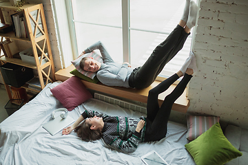 Image showing Quarantine lockdown, stay home concept - young beautiful caucasian couple enjoying new lifestyle during coronavirus worldwide health emergency