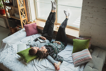 Image showing Quarantine lockdown, stay home concept - young beautiful caucasian couple enjoying new lifestyle during coronavirus worldwide health emergency