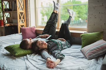 Image showing Quarantine lockdown, stay home concept - young beautiful caucasian couple enjoying new lifestyle during coronavirus worldwide health emergency