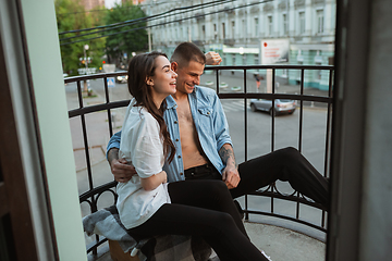 Image showing Quarantine lockdown, stay home concept - young beautiful caucasian couple enjoying new lifestyle during coronavirus worldwide health emergency