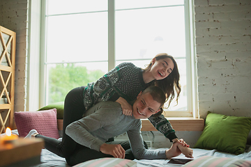 Image showing Quarantine lockdown, stay home concept - young beautiful caucasian couple enjoying new lifestyle during coronavirus worldwide health emergency