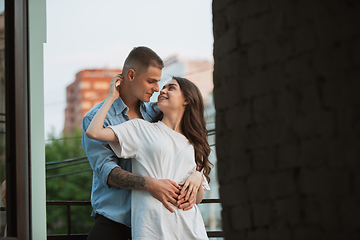 Image showing Quarantine lockdown, stay home concept - young beautiful caucasian couple enjoying new lifestyle during coronavirus worldwide health emergency