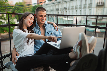 Image showing Quarantine lockdown, stay home concept - young beautiful caucasian couple enjoying new lifestyle during coronavirus worldwide health emergency