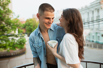 Image showing Quarantine lockdown, stay home concept - young beautiful caucasian couple enjoying new lifestyle during coronavirus worldwide health emergency