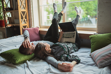 Image showing Quarantine lockdown, stay home concept - young beautiful caucasian couple enjoying new lifestyle during coronavirus worldwide health emergency