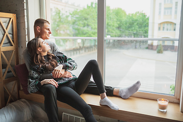 Image showing Quarantine lockdown, stay home concept - young beautiful caucasian couple enjoying new lifestyle during coronavirus worldwide health emergency