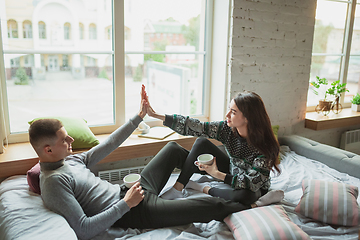 Image showing Quarantine lockdown, stay home concept - young beautiful caucasian couple enjoying new lifestyle during coronavirus worldwide health emergency