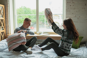 Image showing Quarantine lockdown, stay home concept - young beautiful caucasian couple enjoying new lifestyle during coronavirus worldwide health emergency