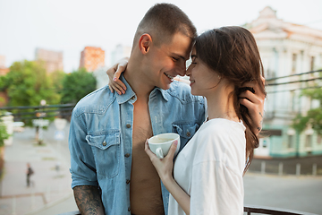 Image showing Quarantine lockdown, stay home concept - young beautiful caucasian couple enjoying new lifestyle during coronavirus worldwide health emergency