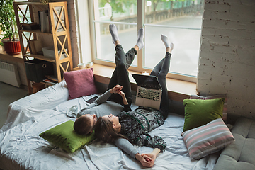 Image showing Quarantine lockdown, stay home concept - young beautiful caucasian couple enjoying new lifestyle during coronavirus worldwide health emergency