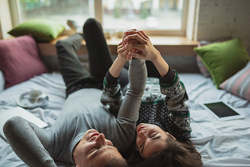 Image showing Quarantine lockdown, stay home concept - young beautiful caucasian couple enjoying new lifestyle during coronavirus worldwide health emergency